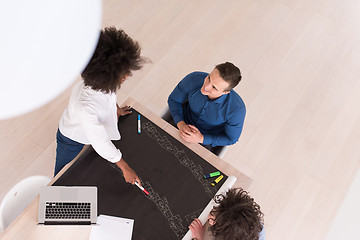 Image showing top view of Multiethnic startup business team on meeting