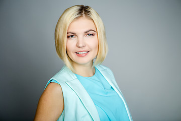 Image showing Smiling blonde on empty background