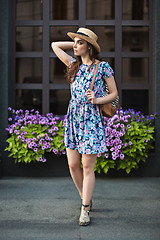 Image showing The fashion woman portrait of young pretty trendy girl posing at the city in Europe
