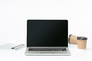 Image showing The front view of notebook and cup of coffee. Inspiration and mock-up concept