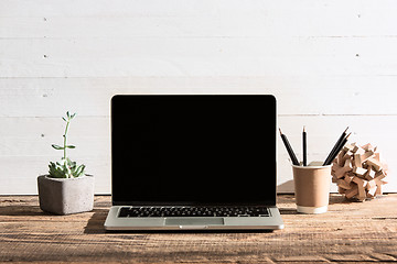 Image showing The front view of notebook and cup of coffee. Inspiration and mock-up concept