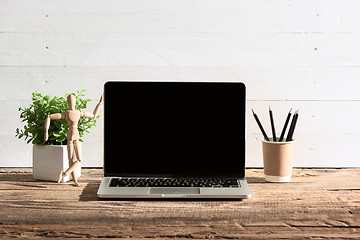 Image showing The front view of notebook and cup of coffee. Inspiration and mock-up concept