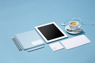 Image showing The laptop, pens, phone, note with blank screen on table