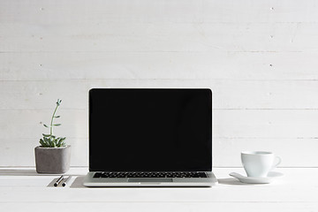 Image showing The front view of notebook and cup of coffee. Inspiration and mock-up concept