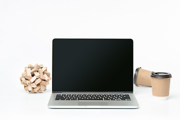 Image showing The front view of notebook and cup of coffee. Inspiration and mock-up concept