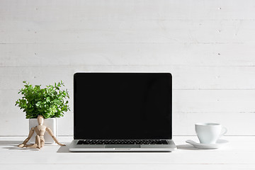 Image showing The front view of notebook and cup of coffee. Inspiration and mock-up concept