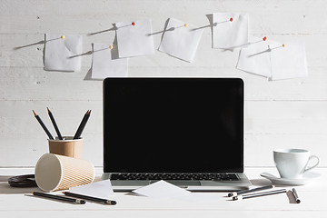 Image showing The front view of notebook and cup of coffee. Inspiration and mock-up concept