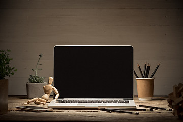 Image showing The front view of notebook and cup of coffee. Inspiration and mock-up concept