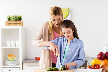 Image showing happy family cooking dinner at home kitchen