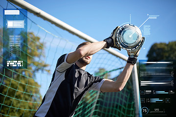 Image showing goalkeeper with ball at football goal on field