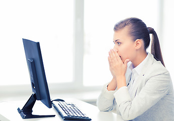 Image showing stressed student with computer in office