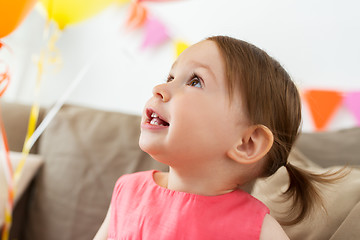 Image showing happy baby girl on birthday party at home