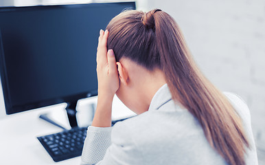 Image showing stressed woman with computer