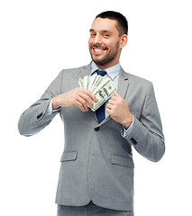 Image showing smiling businessman with american dollar money