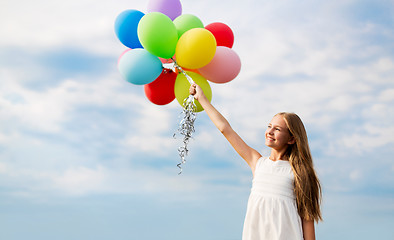 Image showing happy girl in sunglasses with air balloons
