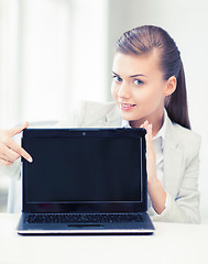 Image showing businesswoman with laptop in office