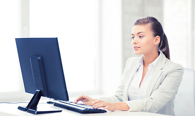 Image showing businesswoman with computer in office