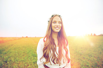 Image showing smiling young hippie woman on cereal field