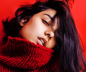 Image showing young pretty indian mulatto girl in red sweater posing emotional, fashion hipster teenage, lifestyle people concept 