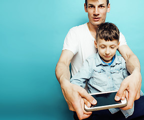 Image showing young pretty man model with little cute son playing together, lifestyle modern people concept, family male 