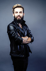 Image showing portrait of young bearded hipster guy on gray dark background close up, brutal modern man, lifestyle people concept 