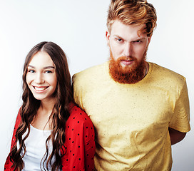 Image showing young pretty teenage couple, hipster guy with his girlfriend happy smiling and hugging isolated on white background, lifestyle people concept