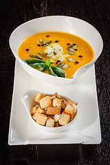 Image showing Pumpkin and soup with cream and pumpkin seeds