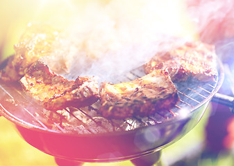 Image showing meat cooking on barbecue grill at summer party