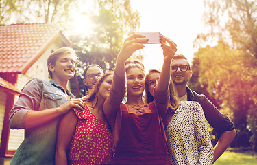 Image showing friends taking selfie at party in summer garden