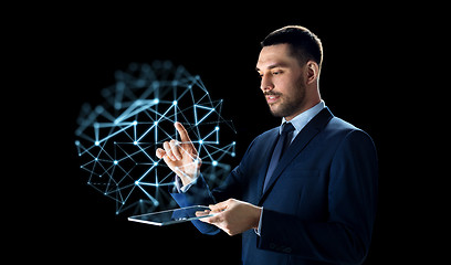 Image showing businessman with tablet pc and low poly projection