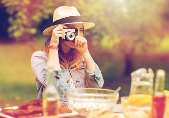 Image showing close up of woman with camera shooting outdoors