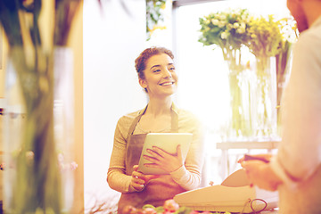 Image showing florist woman and man making order at flower shop