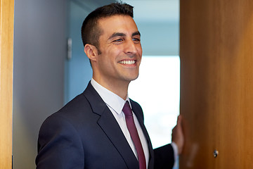 Image showing businessman at hotel room or office door