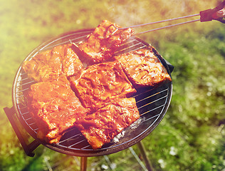 Image showing meat cooking on barbecue grill at summer party