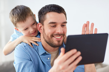 Image showing father and son with tablet pc having video chat