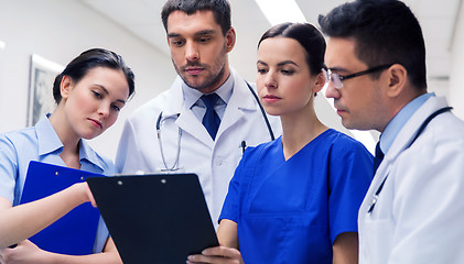 Image showing group of medics with clipboards at hospital