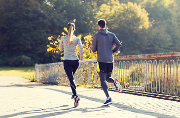 Image showing couple running or jogging outdoors