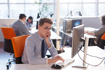 Image showing businessman working using a computer in startup office