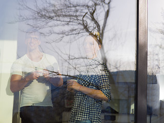 Image showing young couple enjoying morning coffee