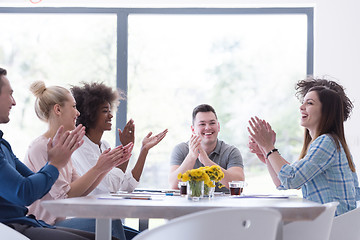 Image showing multiethnic startup Group of young business people celebrating s