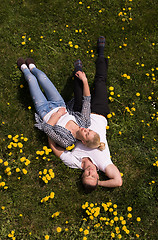 Image showing man and woman lying on the grass