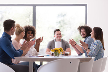 Image showing multiethnic startup Group of young business people celebrating s