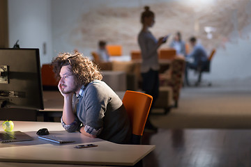 Image showing businessman relaxing at the desk