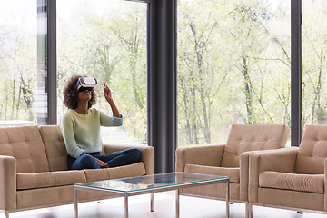 Image showing black woman using VR headset glasses of virtual reality