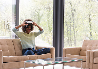 Image showing black woman using VR headset glasses of virtual reality