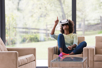 Image showing black woman using VR headset glasses of virtual reality