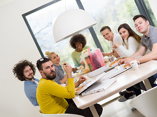 Image showing multiethnic group of happy friends lunch time