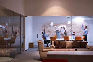 Image showing Group of young business people throwing documents