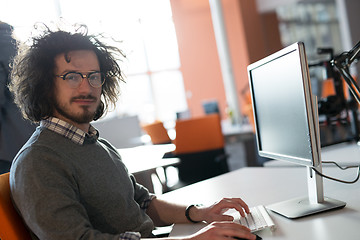 Image showing businessman working using a computer in startup office