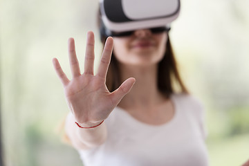 Image showing woman using VR-headset glasses of virtual reality